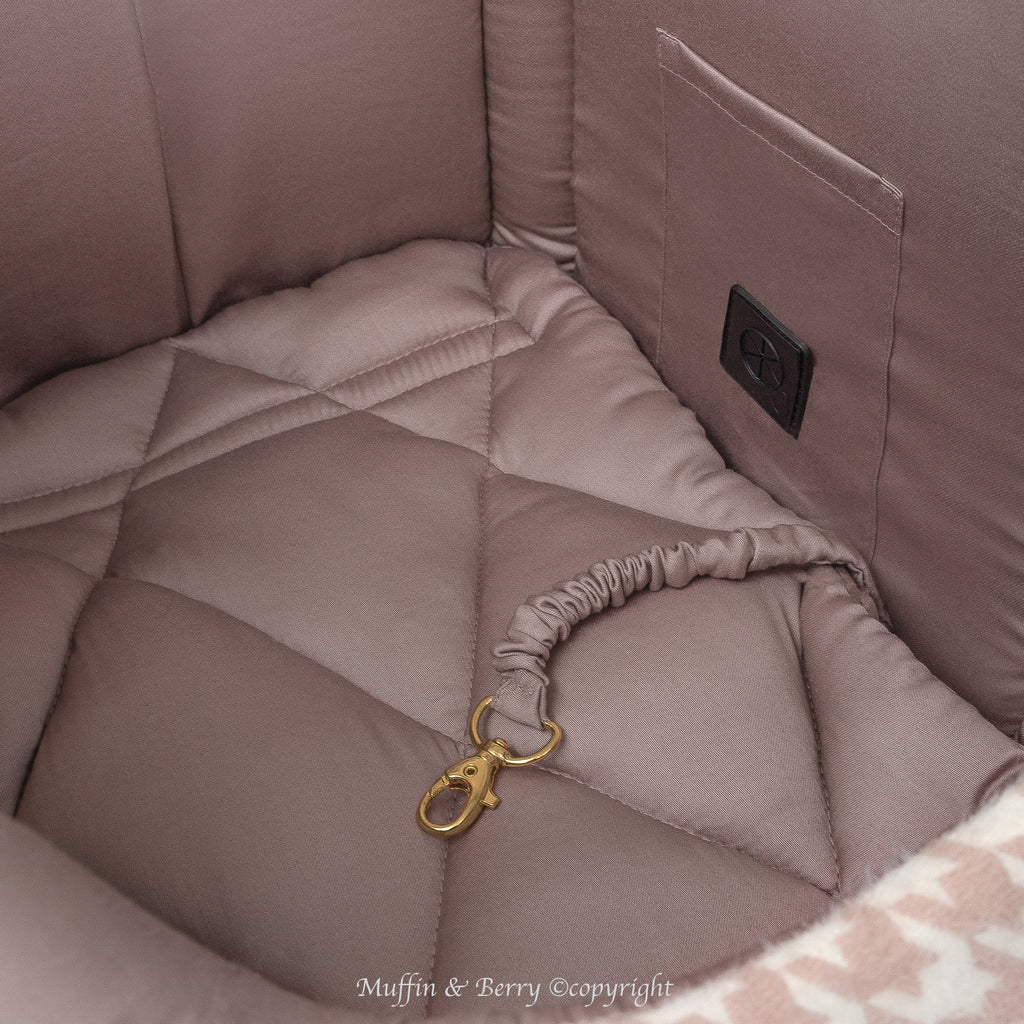 Interior close-up of DAPHNE dog carrier bag showing dusty rose cotton satin lining, inside pocket, waste bag dispenser and gold safety leash clip, by Muffin & Berry