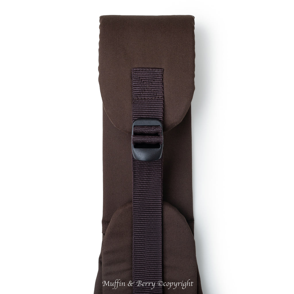 Close-up of BONNIE brown pet sling carrier padded shoulder strap with slide buckle, adjustable dark brown nylon webbing, by Muffin & Berry