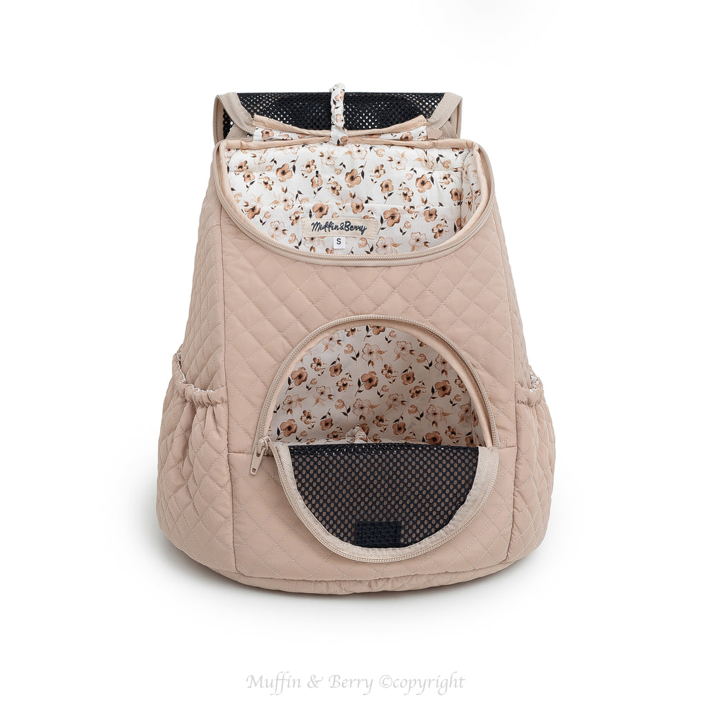 Beige quilted front pet carrier with both open mesh windows showing floral cotton lining inside – by Muffin & Berry