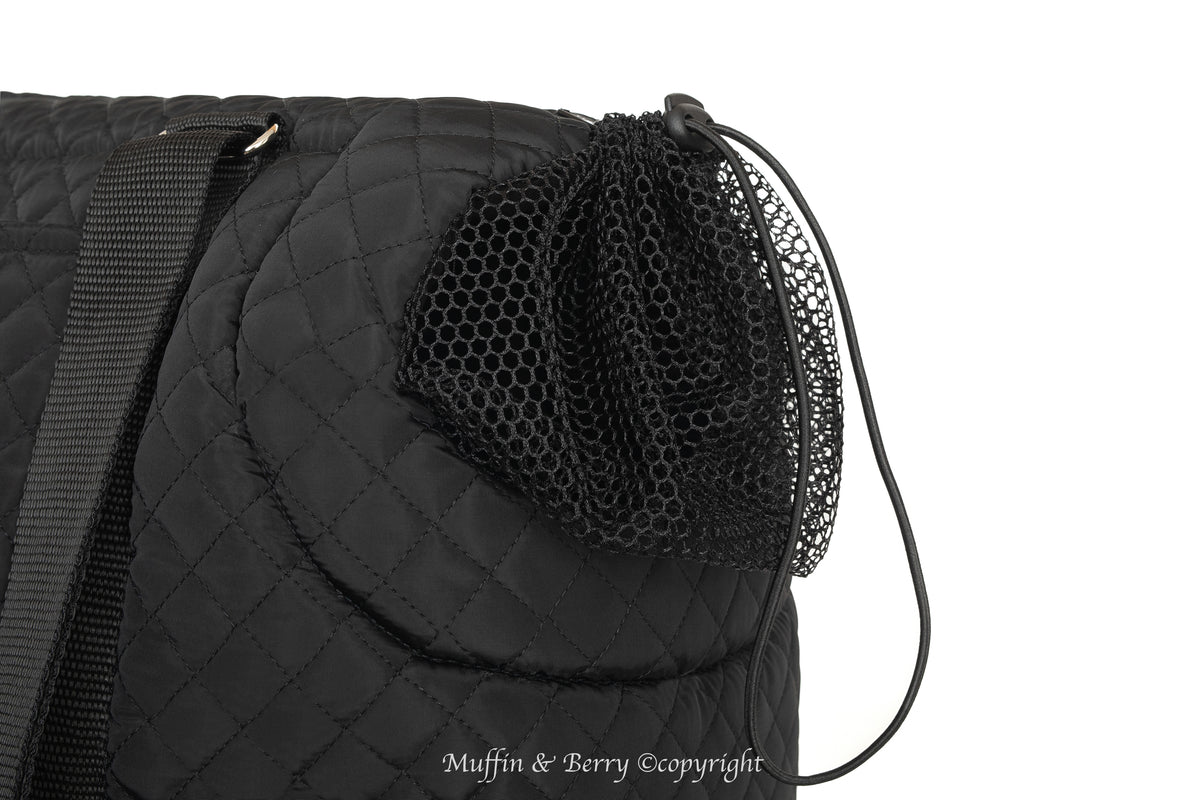 Close-up of optional black mesh cover on head opening of ROCCO black quilted dog carrier bag, by Muffin & Berry