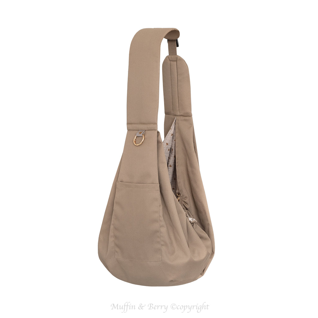 Muffin & Berry taupe trench fabric pet sling carrier Tabitha full view with front pocket, gold O-ring and floral double gauze interior lining – premium dog and cat sling bag