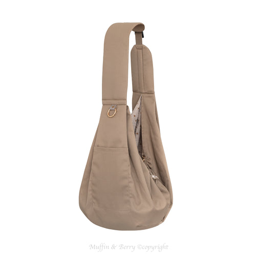 Muffin & Berry taupe trench fabric pet sling carrier Tabitha full view with front pocket, gold O-ring and floral double gauze interior lining – premium dog and cat sling bag