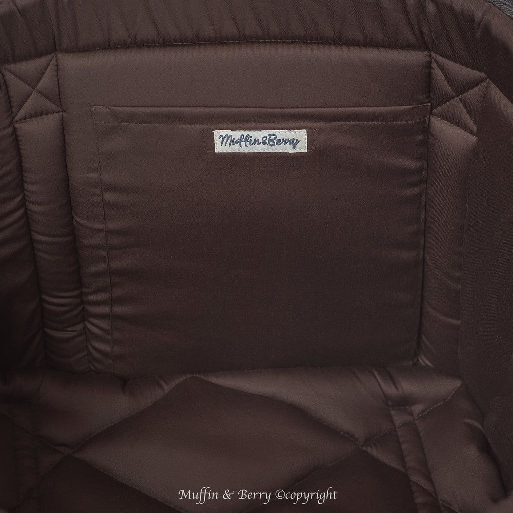 Close-up KINSLEY dog carrier bag interior with chocolate brown quilted cushion and Muffin & Berry branded inside pocket