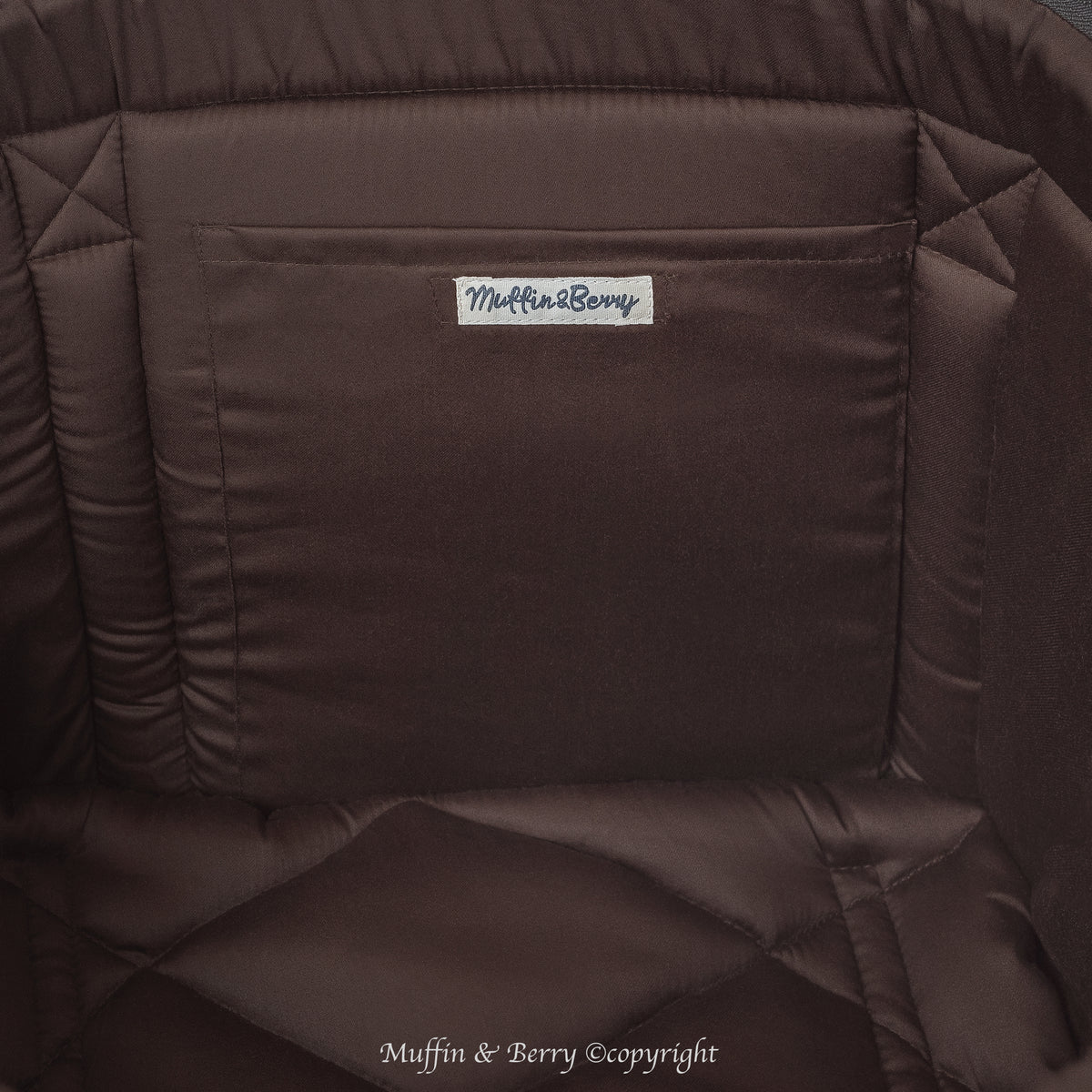 Close-up KINSLEY dog carrier bag interior with chocolate brown quilted cushion and Muffin & Berry branded inside pocket