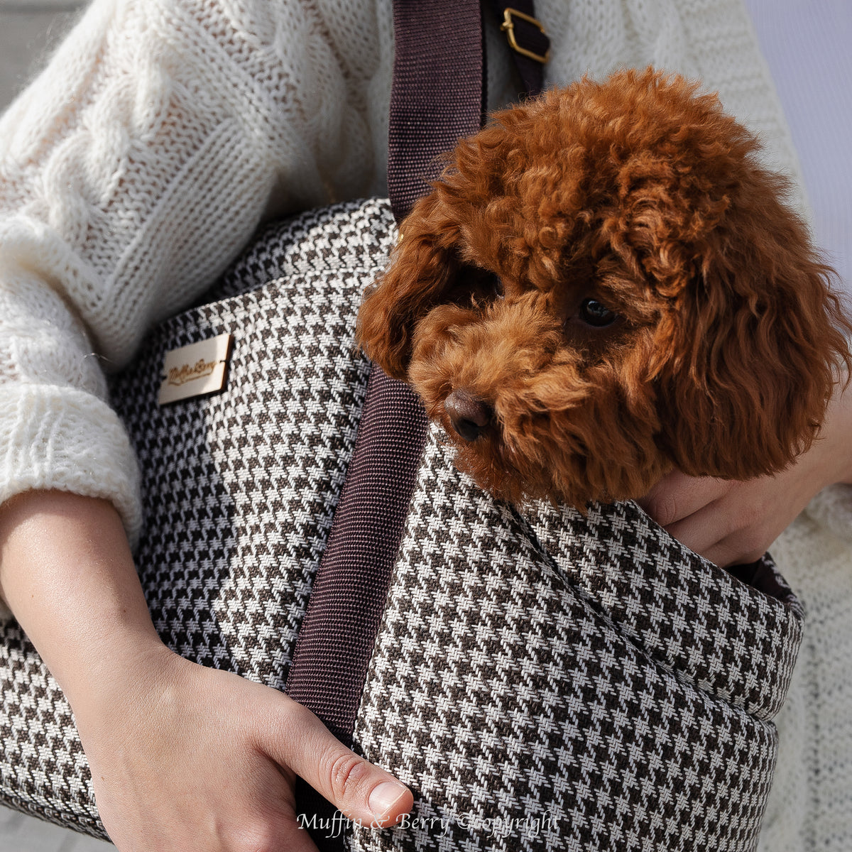 Chocolate brown and white houndstooth dog carrier bag KINSLEY front view with brown toy poodle peeking out, from Muffin & Berry