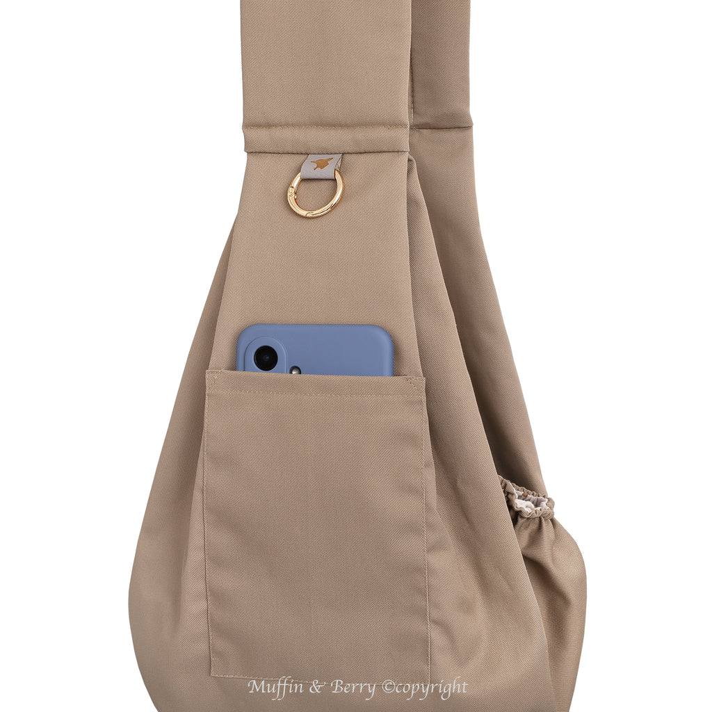 Muffin & Berry Tabitha pet sling bag close-up of front phone pocket with gold O-ring – taupe foldable dog sling bag with storage pocket