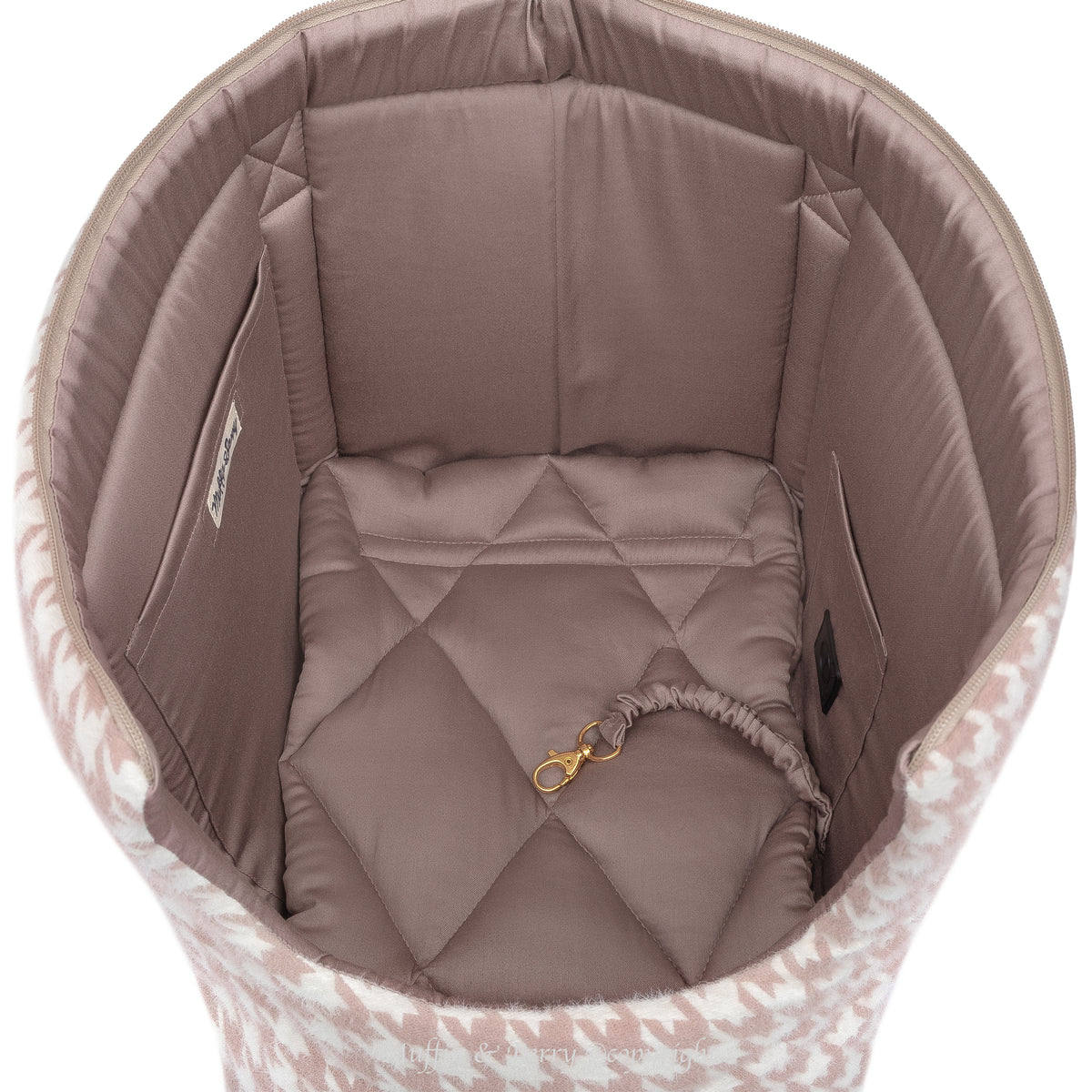 Top view of DAPHNE dog carrier bag interior showing dusty rose cotton satin lining, quilted cushion and gold safety leash clip, by Muffin & Berry