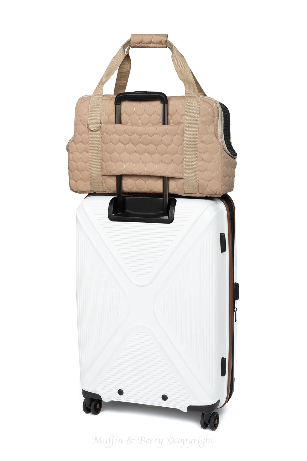 Muffin & Berry beige pet travel carrier Mila attached to suitcase handle via luggage sleeve – hands-free travel solution for pet owners