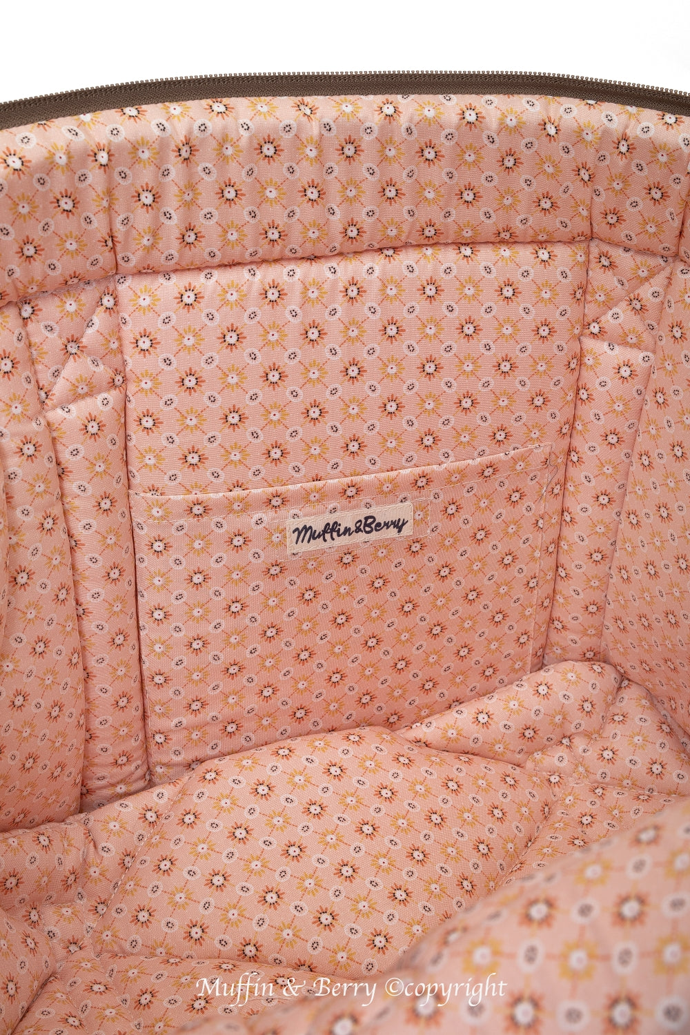 Interior close-up of AMELIA dog carrier bag showing peach floral cotton lining and inside pocket, by Muffin & Berry