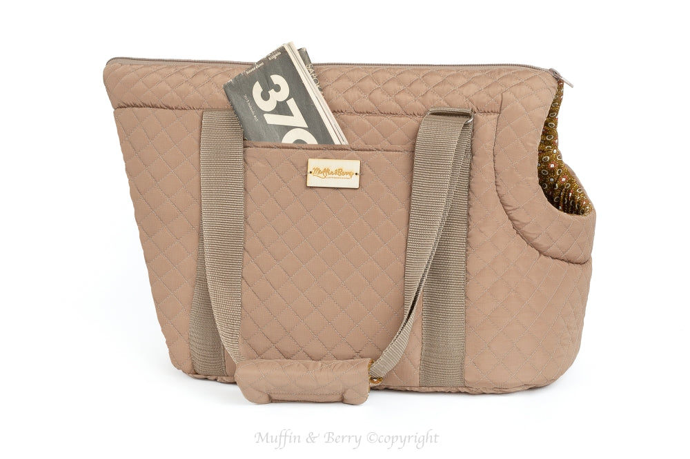 AMELIA camel quilted dog carrier bag side view on white background, magazine in outside pocket and shoulder strap visible, by Muffin & Berry